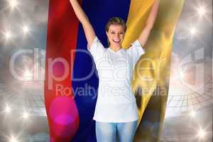 Composite image of pretty football fan in white cheering holding