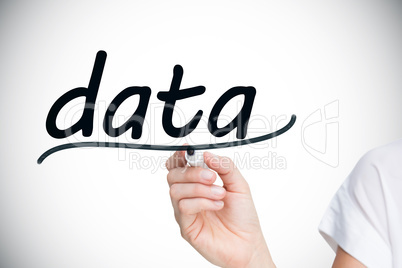 Businesswoman writing the word data