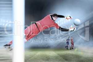 Composite image of fit goal keeper jumping up