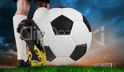 Composite image of football boot kicking huge ball