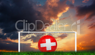 Composite image of football in swiss colours
