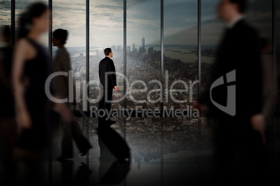 Composite image of businessman standing