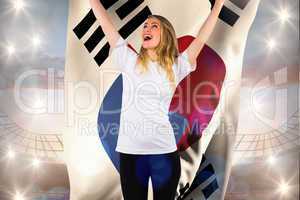 Composite image of pretty football fan in white cheering holding