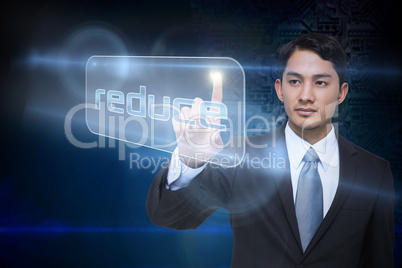 Businessman pointing to word reduce