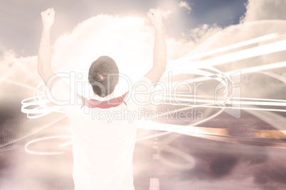 Composite image of cheering football fan in white