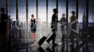 Composite image of redhead businesswoman in a blindfold