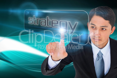 Businessman pointing to word strategy