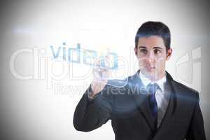 Businessman pointing to word video