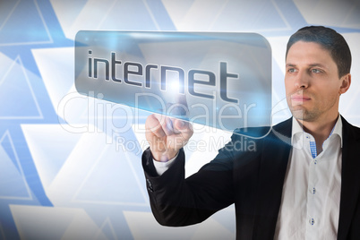 Businessman pointing to word internet