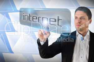 Businessman pointing to word internet