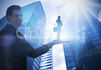 Composite image of businessman holding student