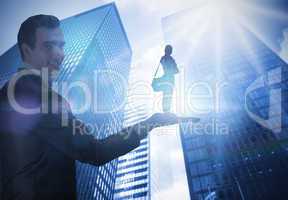 Composite image of businessman holding student