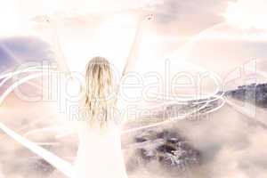 Composite image of pretty football fan in white cheering