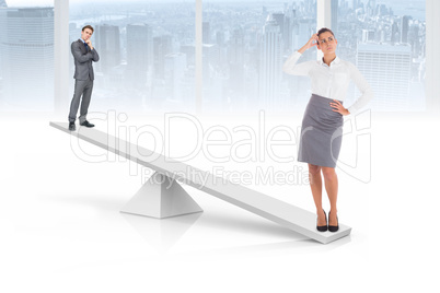 White scales weighing businessman and businesswoman