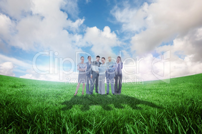 Composite image of business team looking at camera