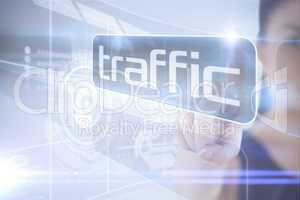 Businesswoman pointing to word traffic