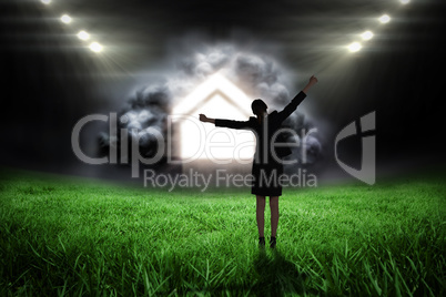 Composite image of excited businesswoman cheering