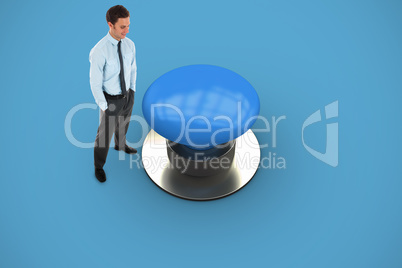 Composite image of happy businessman standing with hands in pock