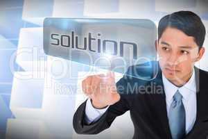 Businessman pointing to word solution