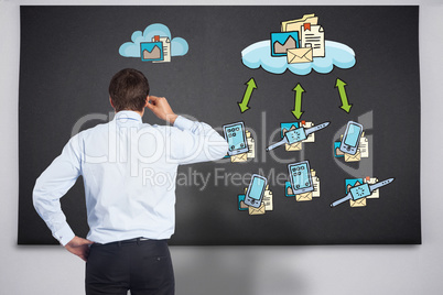 Composite image of thinking businessman tilting glasses