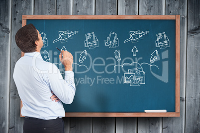 Composite image of thinking businessman holding pen