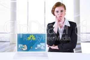 Composite image of thinking redhead businesswoman