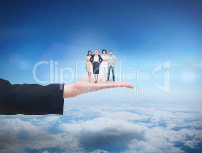 Composite image of business team looking at camera