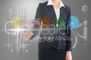 Businesswoman touching the word sales on interface