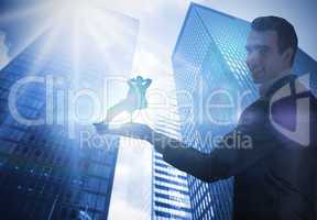 Composite image of businessman holding business man in swivel ch