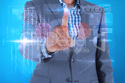Businessman touching the words social networks on interface