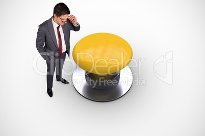 Composite image of thinking businessman touching his glasses