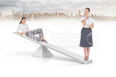 White scales weighing two businesswomen