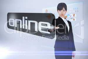 Businesswoman pointing to word online