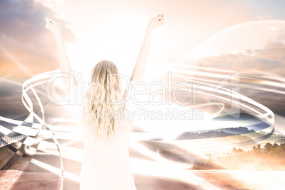 Composite image of pretty football fan in white cheering