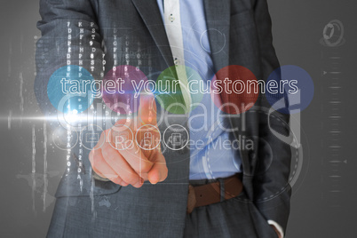 Businessman touching the words target your customers on interfac