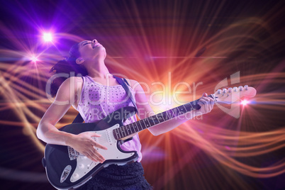 Composite image of pretty girl playing guitar