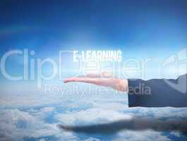 Businesswomans hand presenting the word e learning