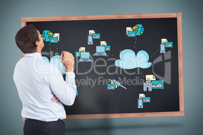 Composite image of thinking businessman holding pen