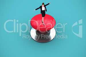 Composite image of businesswoman performing a balancing act