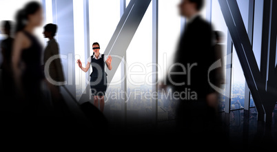 Composite image of redhead businesswoman in a blindfold