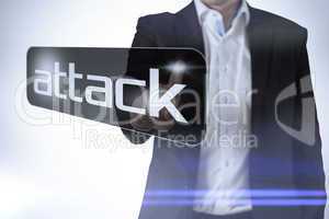 Businessman pointing to word attack