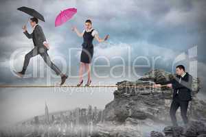 Young businessman pulling a tightrope for business people