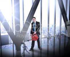 Composite image of businessman watering tiny businessman