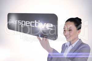 Businesswoman pointing to word perspective