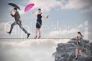 Young businesswoman pulling a tightrope for business people