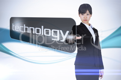 Businesswoman pointing to word technology