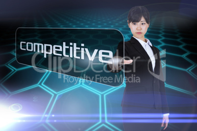 Businesswoman pointing to word competitive