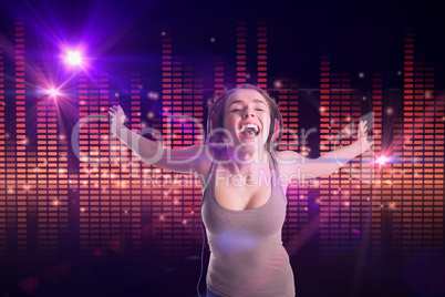 Composite image of pretty girl listening to music