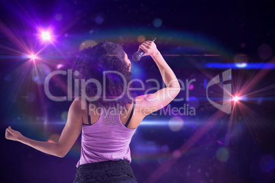 Composite image of pretty girl singing