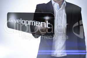 Businessman pointing to word development